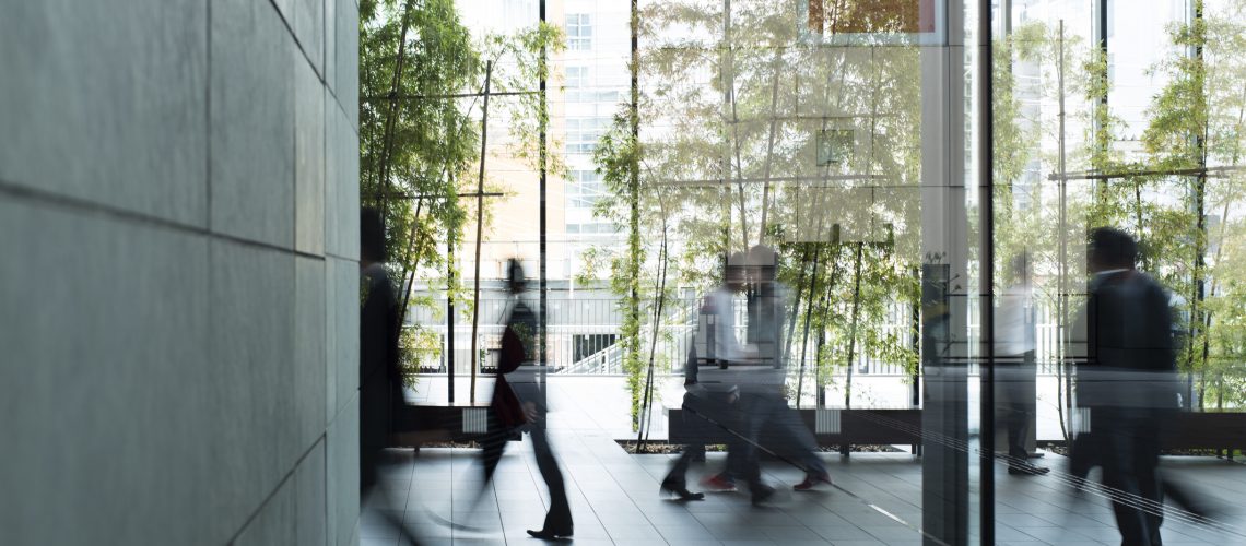 Business person walking in a urban building